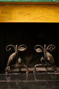 Andirons with oak leaves and fish, 1940