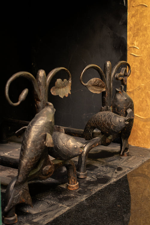 Andirons with oak leaves and fish, 1940