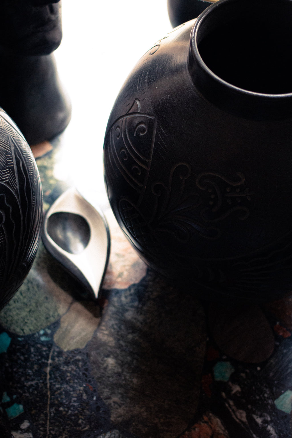 Two large Russian vases, 1920, in sculpted black ceramic